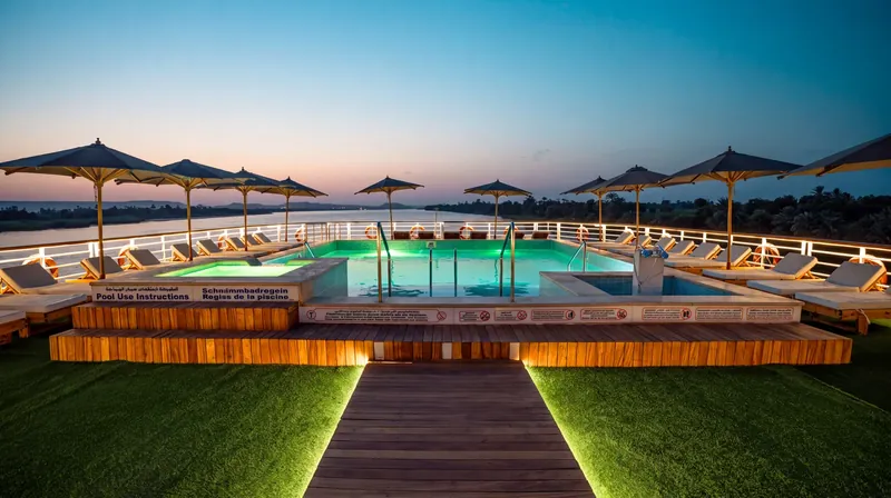 Pool and sundeck of the M/S City and Sea Adonis at dusk